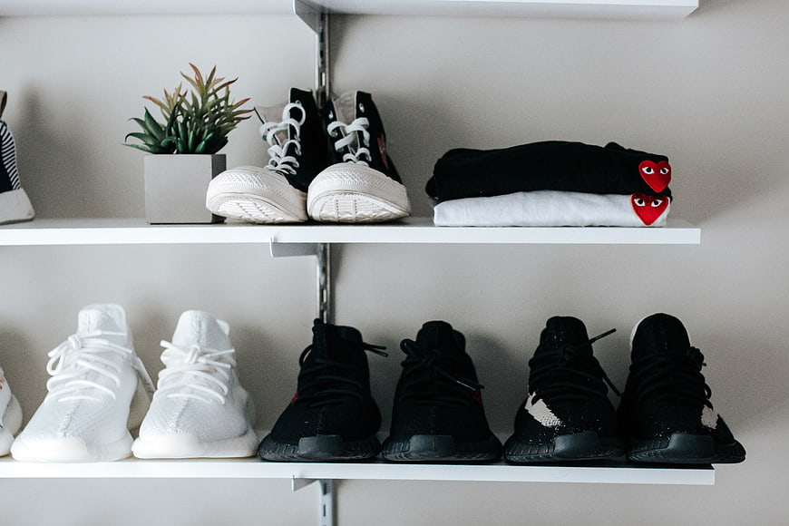 Organized Sneaker Collection on White Shelves