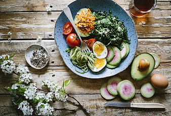 Healthy Spring Salad Bowl with Avocado, Eggs, and Flowers