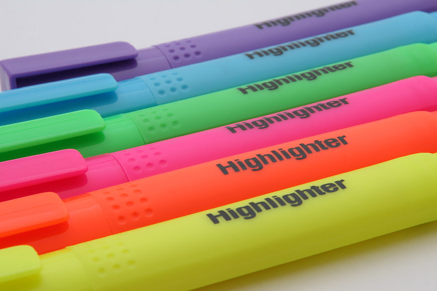 Colorful Highlighter Pens Arranged Diagonally On White Background