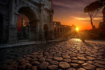 Sunset at the Arch of Constantine and Colosseum in Rome