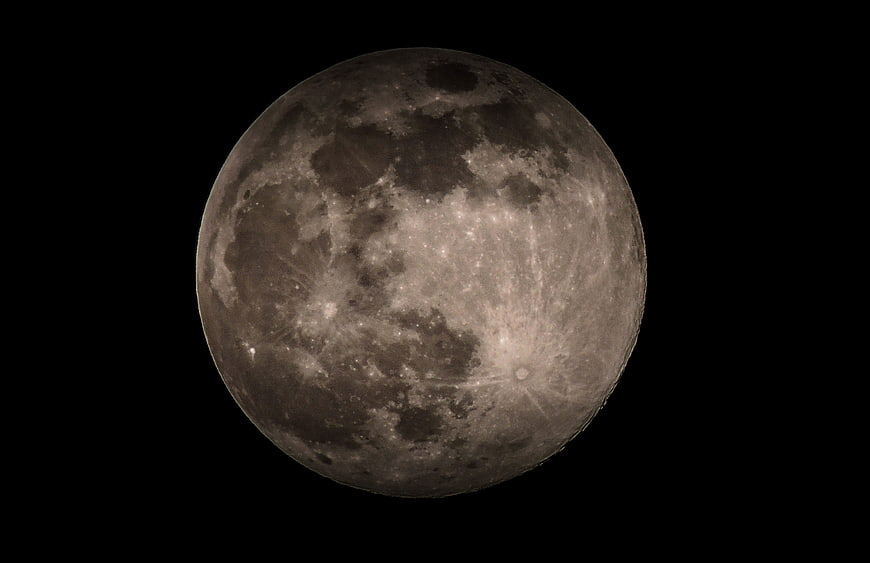 Detailed Full Moon Surface Texture Against Black Sky