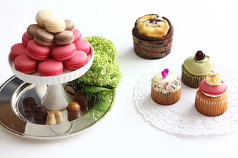 Assorted Macarons and Cupcakes on White Background