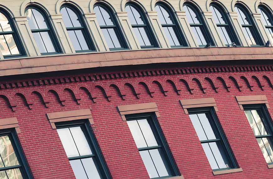 Red Brick Building Facade with Arched Windows