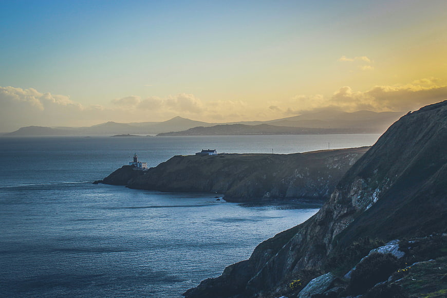 Lighthouse on Irish Coastline at Sunset
