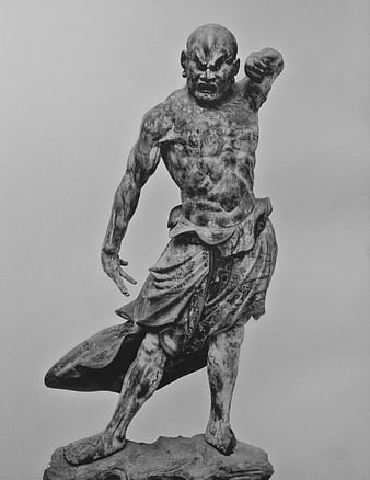 Black and white photo of fierce Buddhist guardian statue