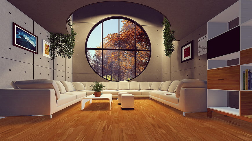 Modern living room with circular window and white sectional sofa