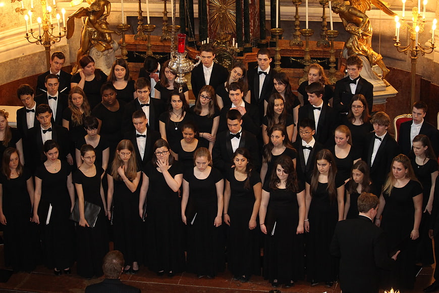 Formal Youth Choir Singing In Historic Chapel Interior