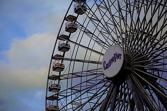 Casino Pier Ferris Wheel Against Blue Sky