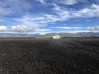 Crashed airplane on black sand beach in Iceland