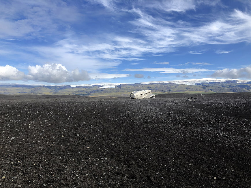 Crashed airplane on black sand beach in Iceland