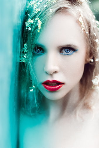 Stylized Portrait of Young Woman With Floral Hair And Bold Red Lips