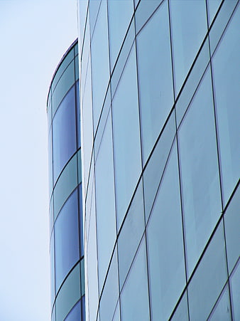 Modern Glass Office Building Facade with Blue Tinted Windows