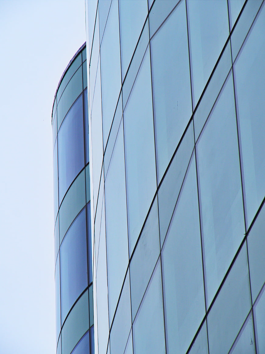 Modern Glass Office Building Facade with Blue Tinted Windows