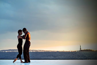 Contemporary Dancers Performing with Statue of Liberty Background