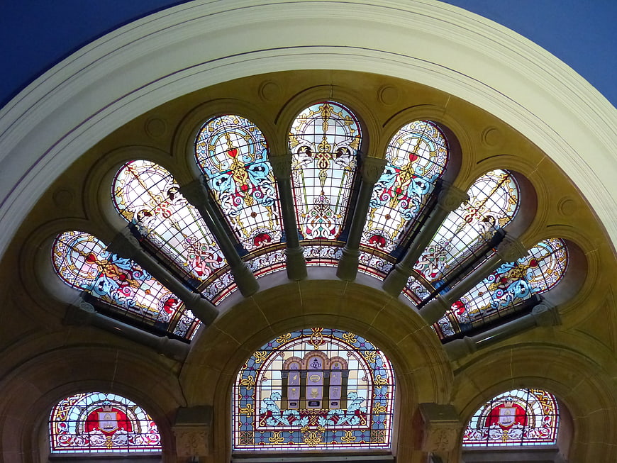 Ornate Stained Glass Windows in Arched Stone Architecture