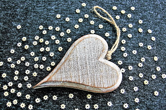 Wooden Heart Ornament with Star-Shaped Pasta on Dark Fabric