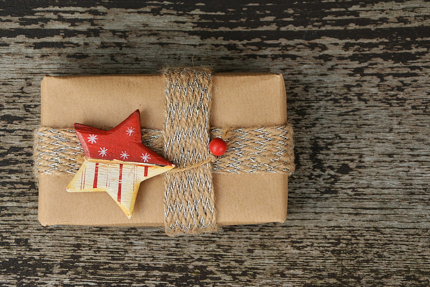 Rustic Christmas Gift Wrapped in Brown Paper with Star Ornament