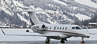 White Private Jet on Snowy Mountain Runway