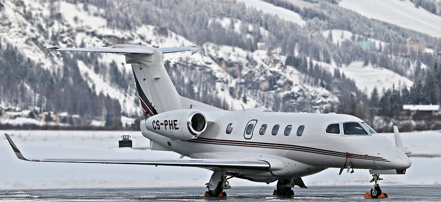 White Private Jet on Snowy Mountain Runway