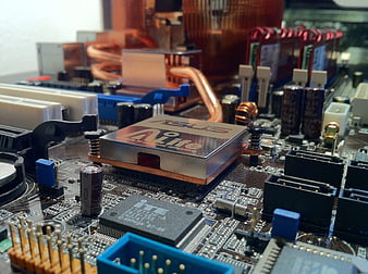 Close-up of ASUS motherboard CPU socket and copper heatsink