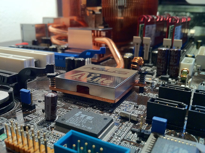 Close-up of ASUS motherboard CPU socket and copper heatsink
