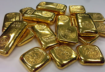 Pile of Gold Bullion Bars on White Background