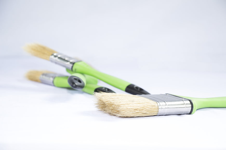 Green Paintbrushes On White Background