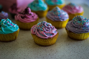 Colorful Cupcakes with Sprinkles on Countertop