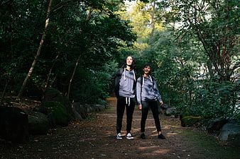 Couple hiking on forest path in nature