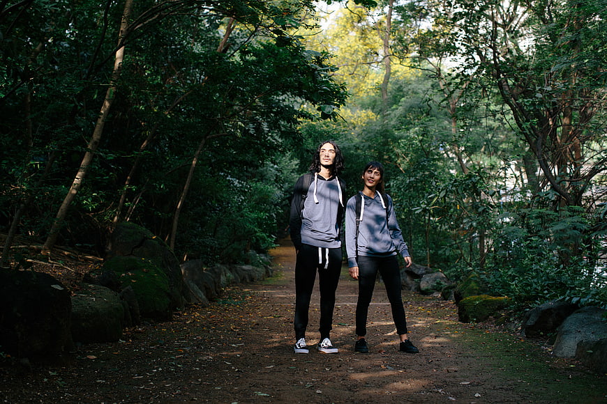 Couple hiking on forest path in nature
