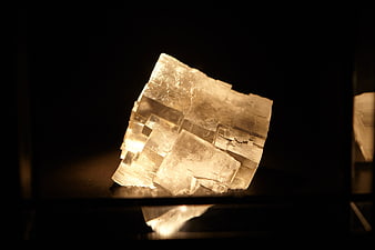 Illuminated Calcite Crystal Cluster on Black Background