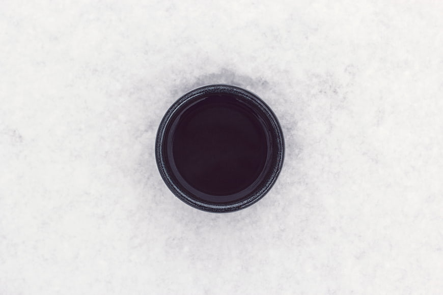 Top View of Black Coffee in Cup on White Marble