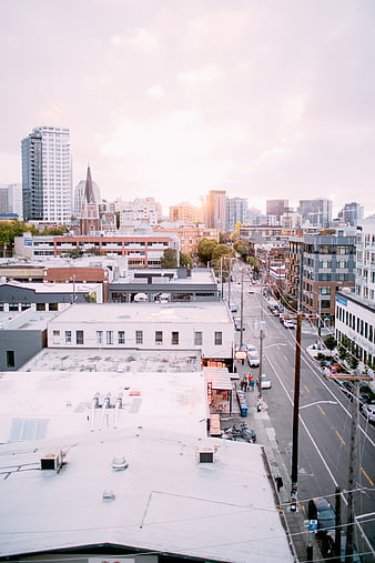 Urban Cityscape with Rooftops and Street View at Sunset