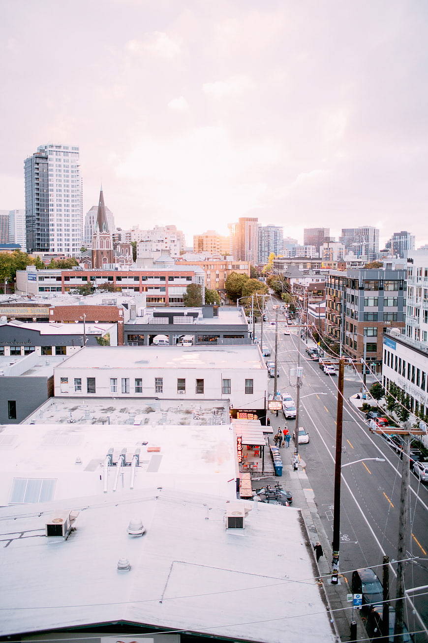 Urban Cityscape with Rooftops and Street View at Sunset