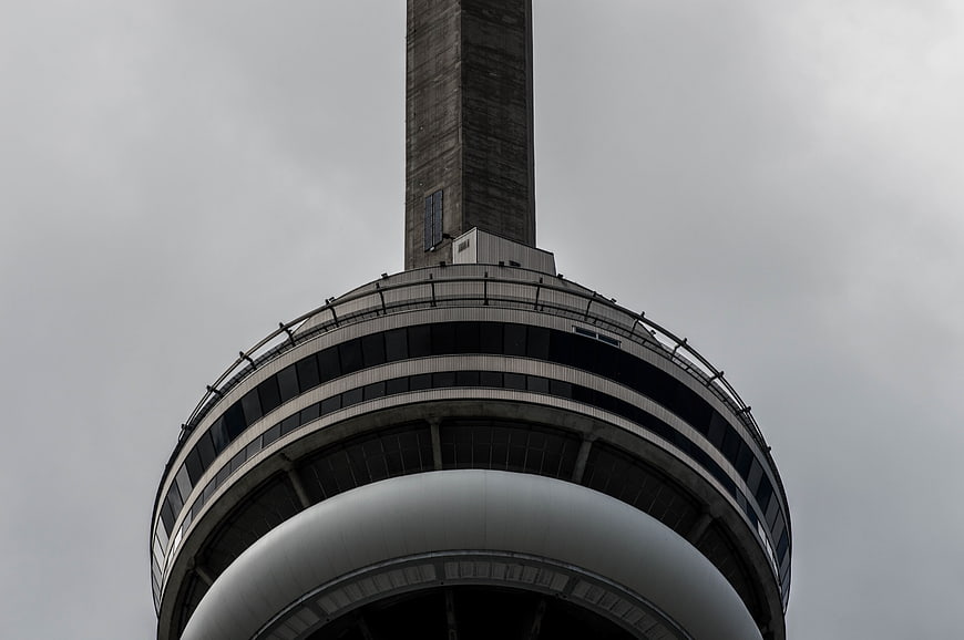 Low angle view of CN Tower against overcast sky