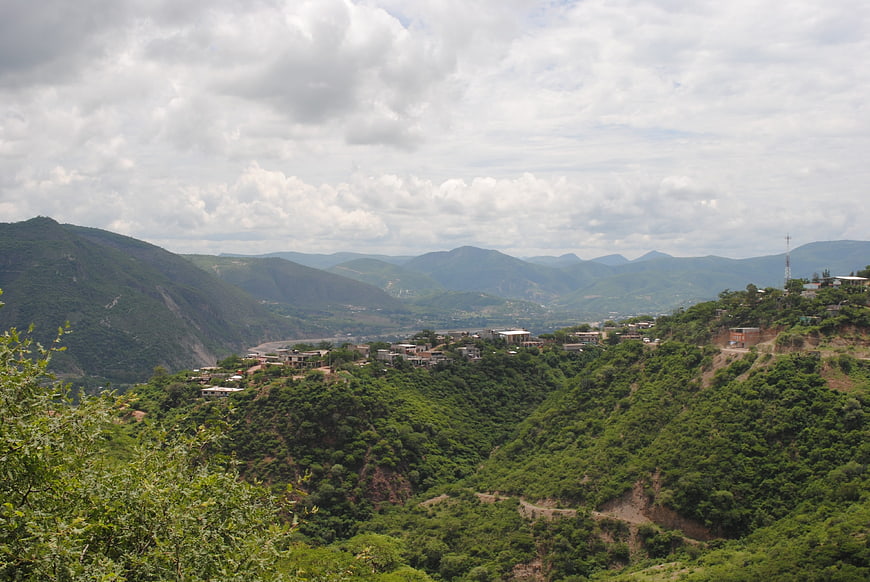 Lush green mountain landscape with village in Tlapa de Comonfort