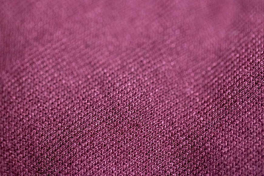 Close-up texture of maroon knitted fabric background