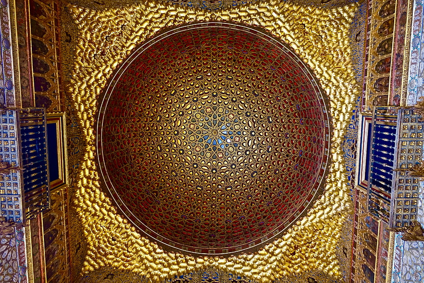 Ornate Golden Dome Ceiling with Red Geometric Patterns