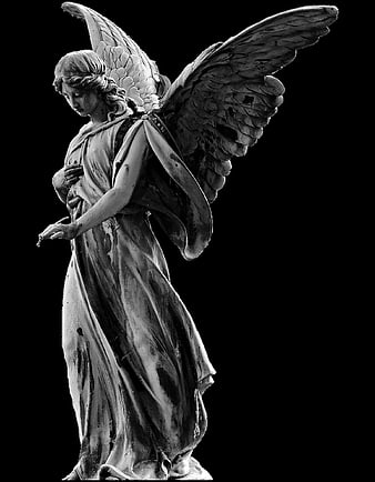 Black and white statue of a grieving angel with wings