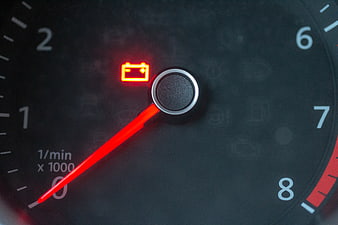 Car Dashboard Battery Warning Light and Tachometer