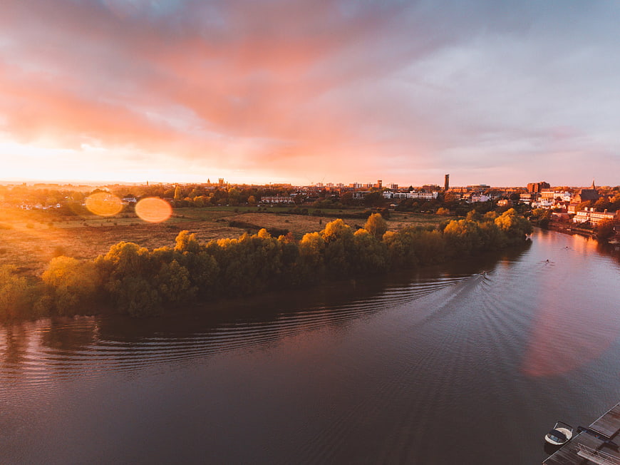 Aerial View of River and Town at Golden Sunset