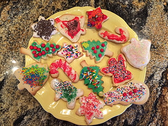 Festive Christmas Sugar Cookies With Sprinkles On Yellow Plate