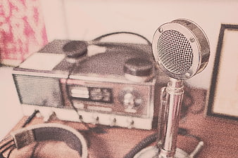 Vintage Microphone and Retro Radio on Wooden Desk