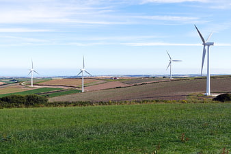 Wind Turbines in Green Rolling Hills Landscape