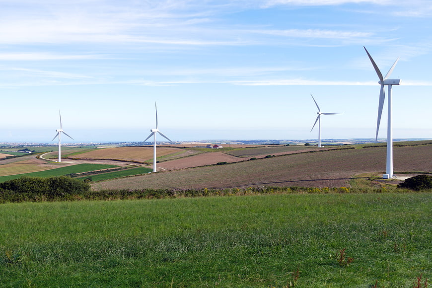 Wind Turbines in Green Rolling Hills Landscape