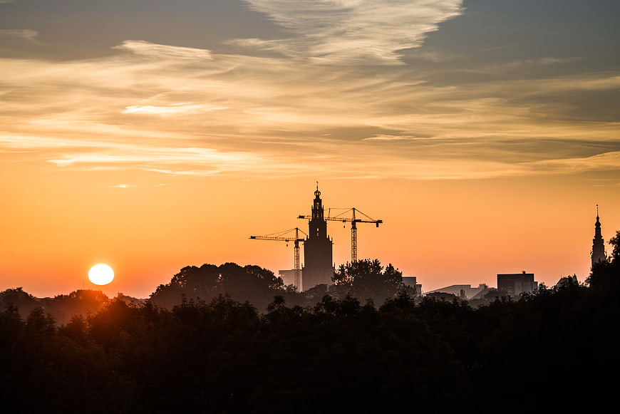 Sunrise Silhouette of Groningen City Skyline with Cranes