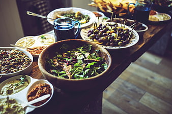 Healthy Mediterranean salad and appetizers on rustic wooden table