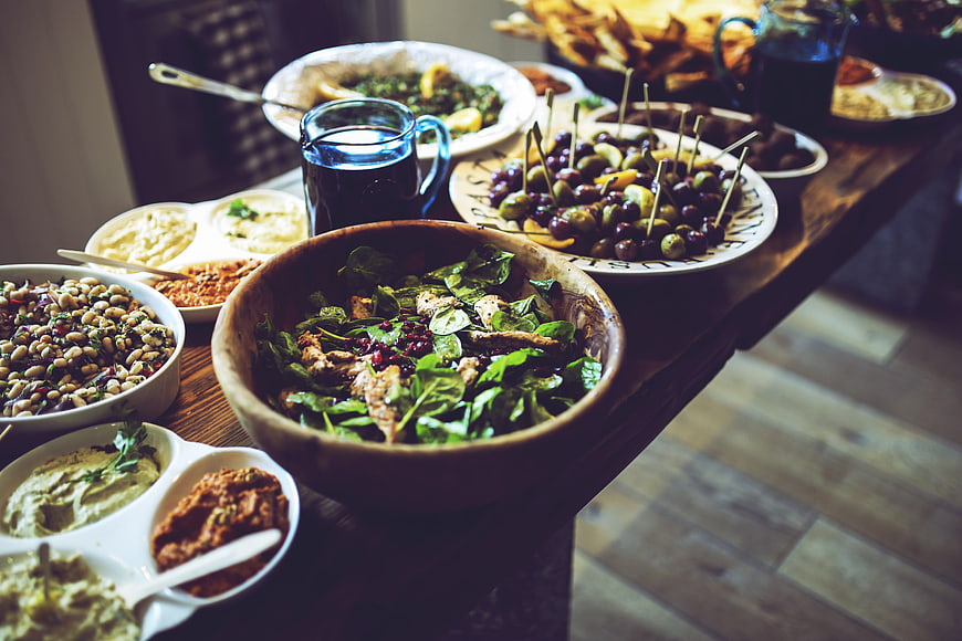 Healthy Mediterranean salad and appetizers on rustic wooden table