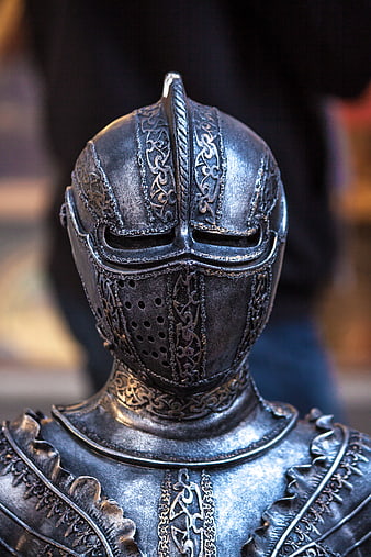 Close-up of ornate medieval knight helmet and armor
