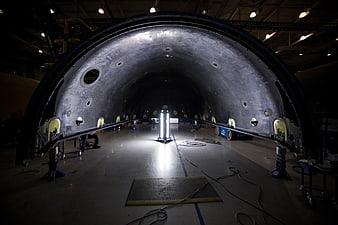 Interior of rocket fuselage under construction in assembly hangar